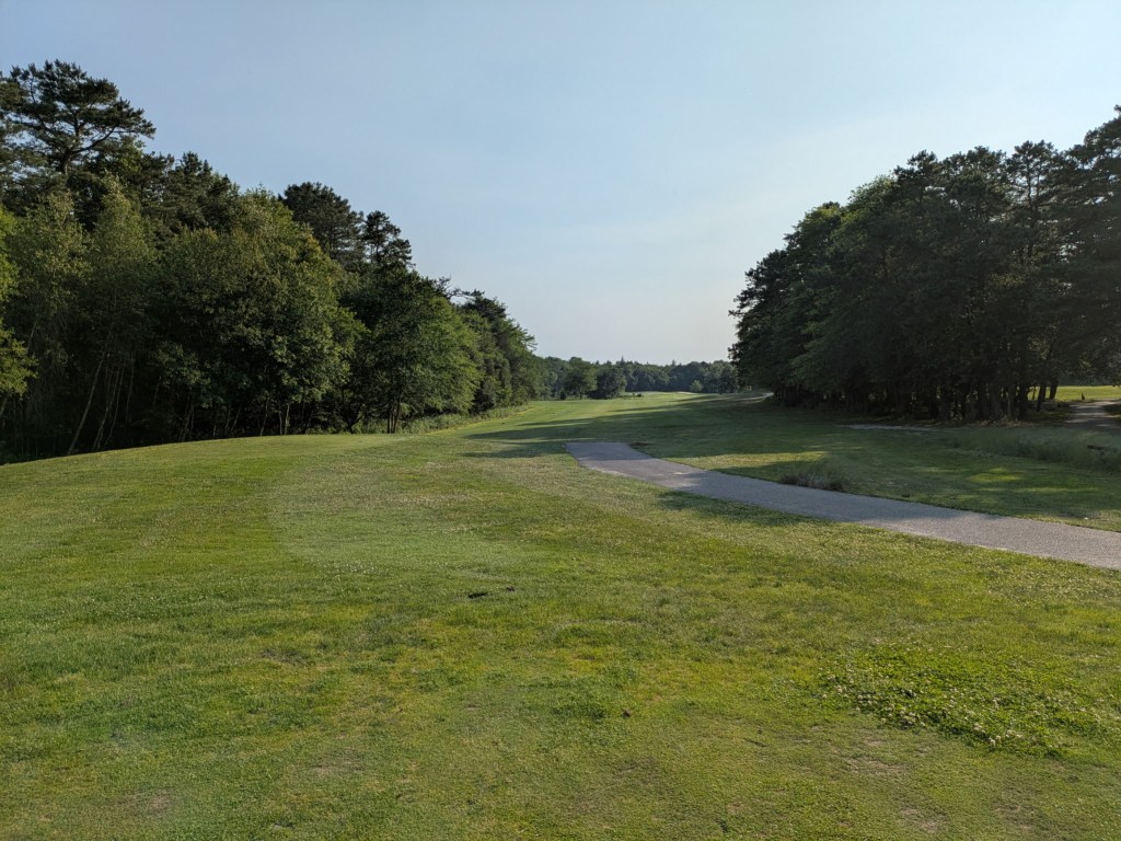 Golf path on golf course green